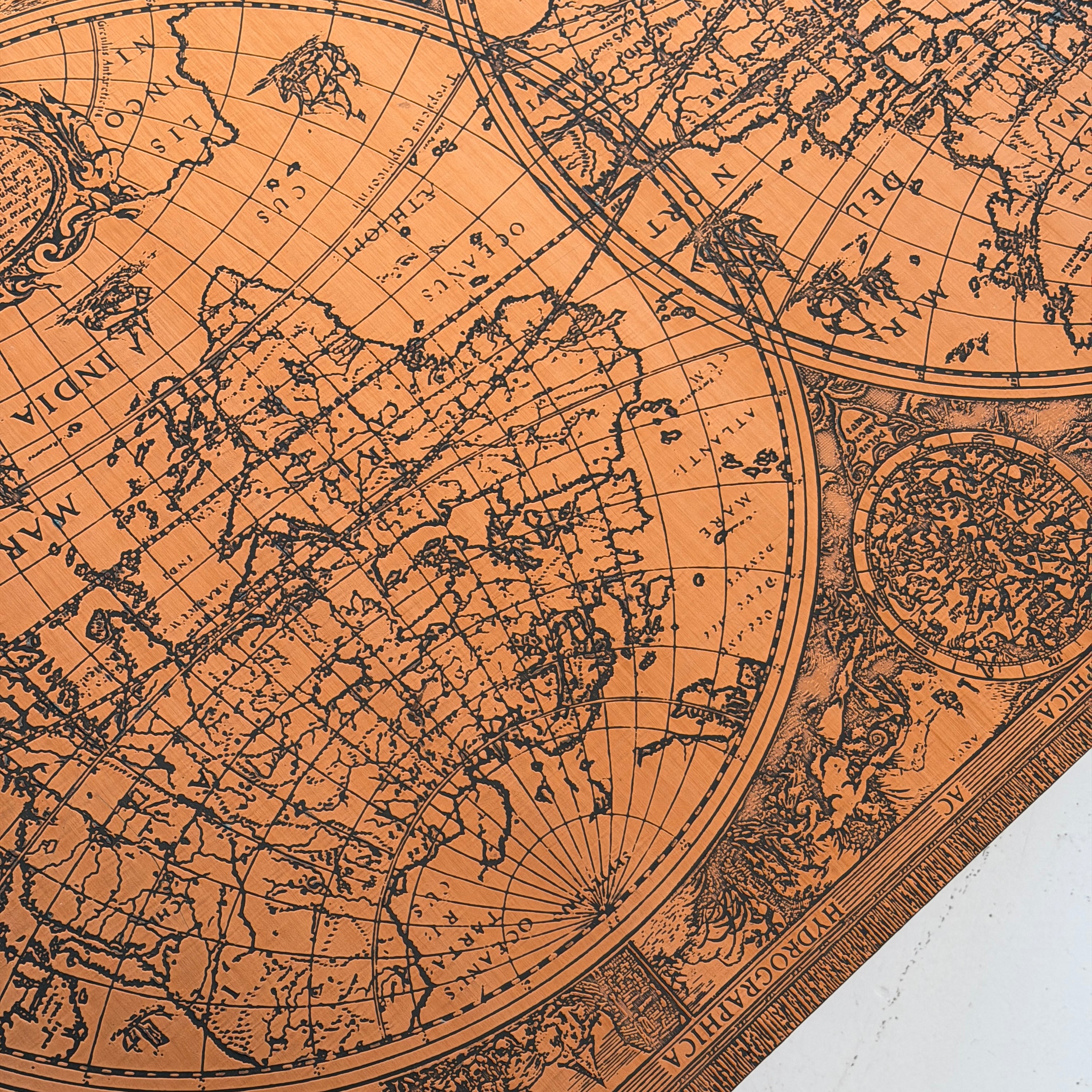 Embossed Map Motif Copper Laminate Coffee Table