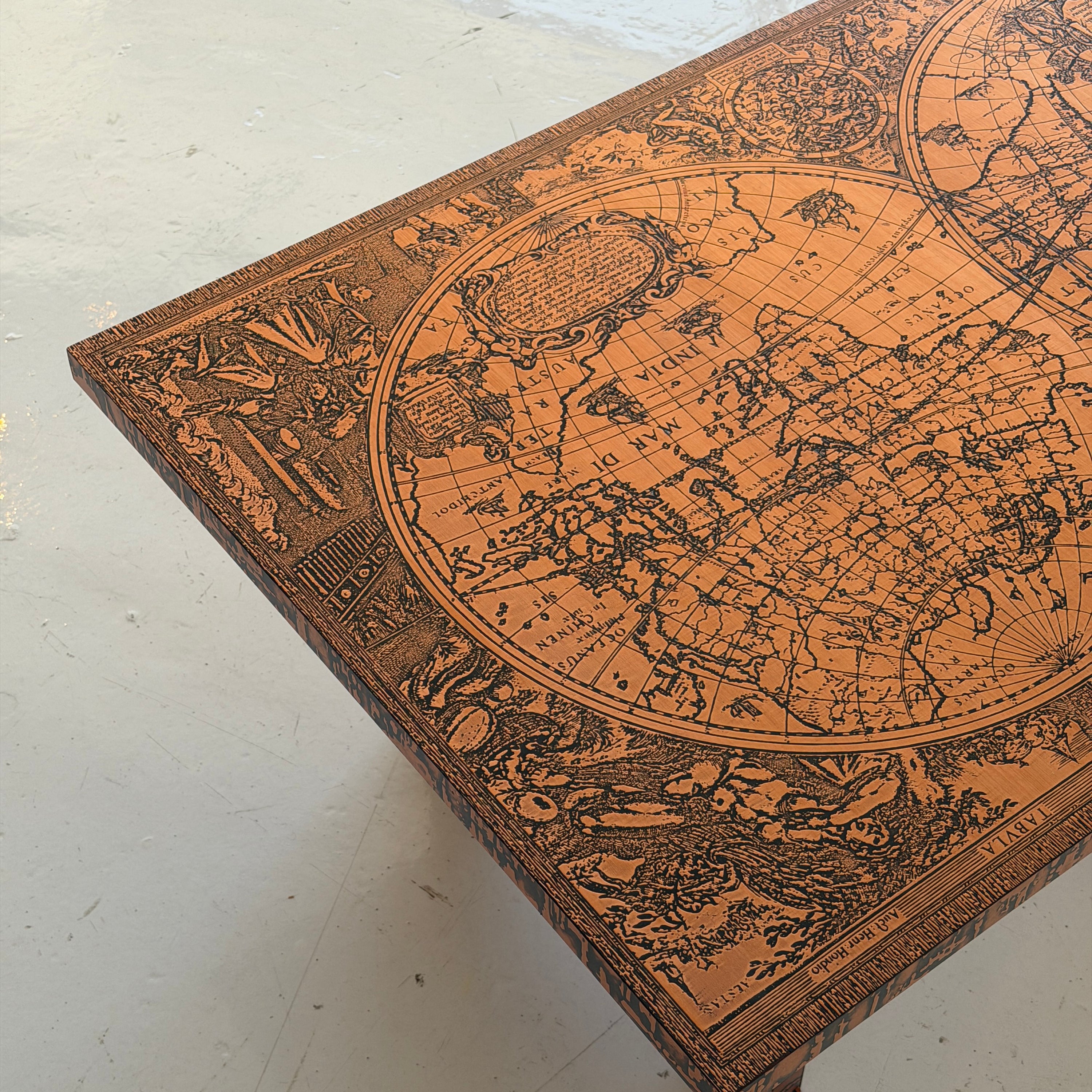 Embossed Map Motif Copper Laminate Coffee Table