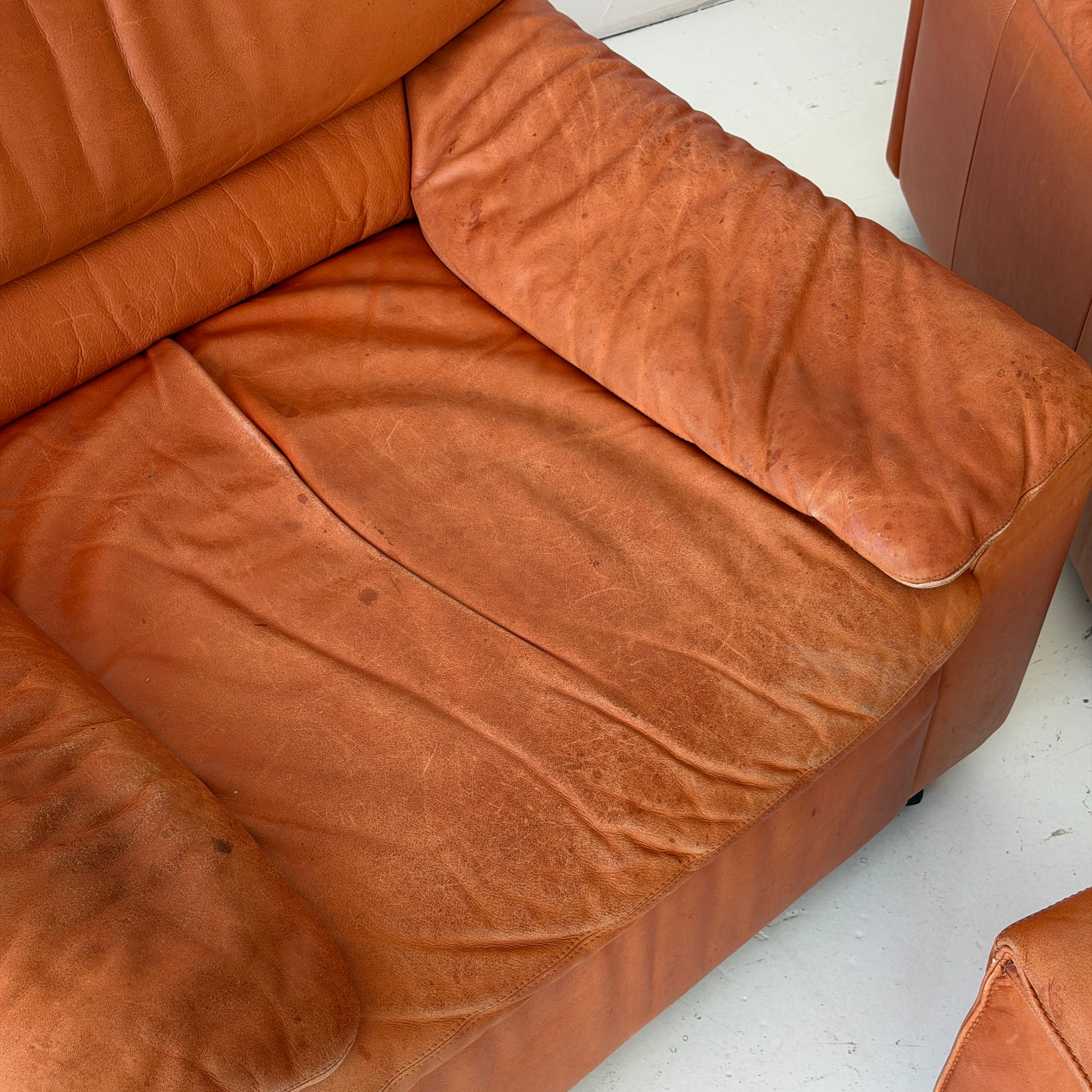 German Orange Leather Lounge Chairs + Ottoman by Dreipunkt